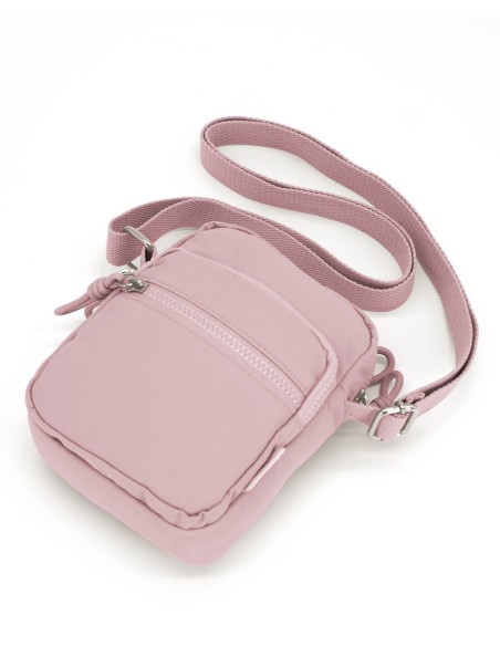 Material resistente polyester. Dimensiones: 19 x 23 x 6 cm. Bolsillos exteriores con cremallera. Correa ajustable Recíbalo en 24